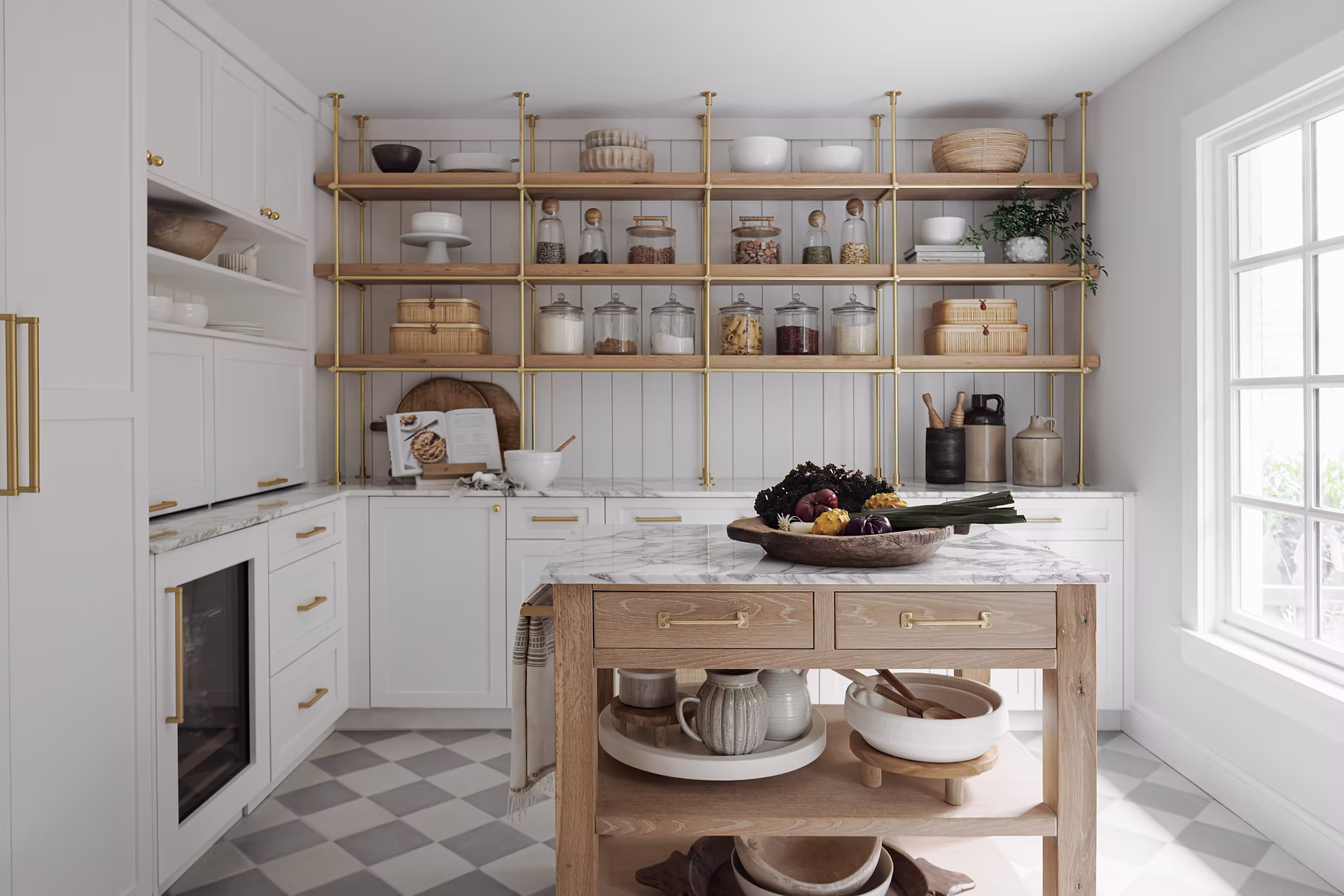 Full Circle project butler's scullery in Potomac MD with brass open display shelving over white beadboard, checkerboard tile floor, and oak work island by Sho and Co Cabinetry