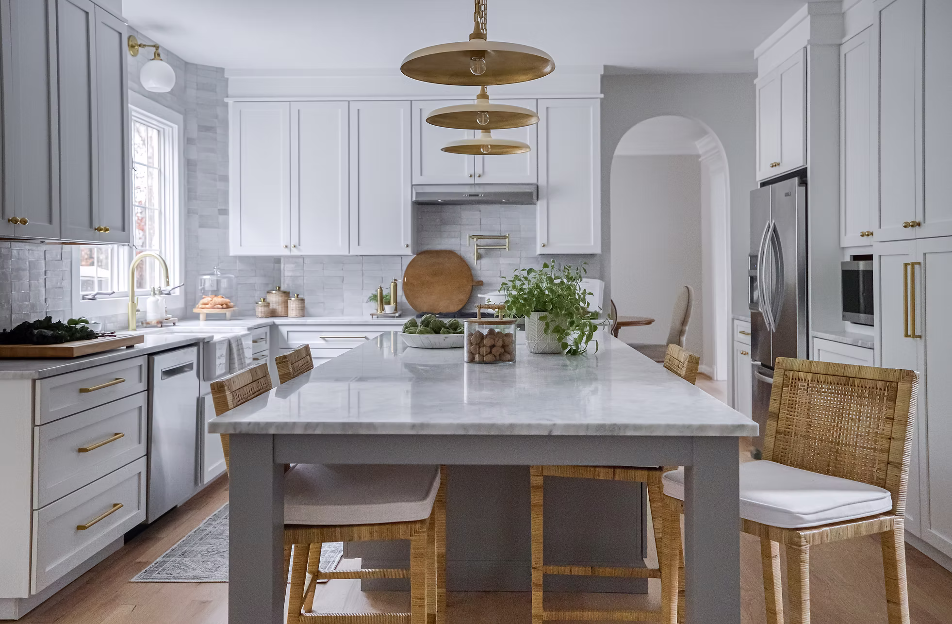 Custom white and soft blue-gray kitchen with marble island and brass pendant lighting at Fresh Start residence in Rockville Montgomery County Maryland by Shoshanna Shapiro for Sho and Co Cabinetry